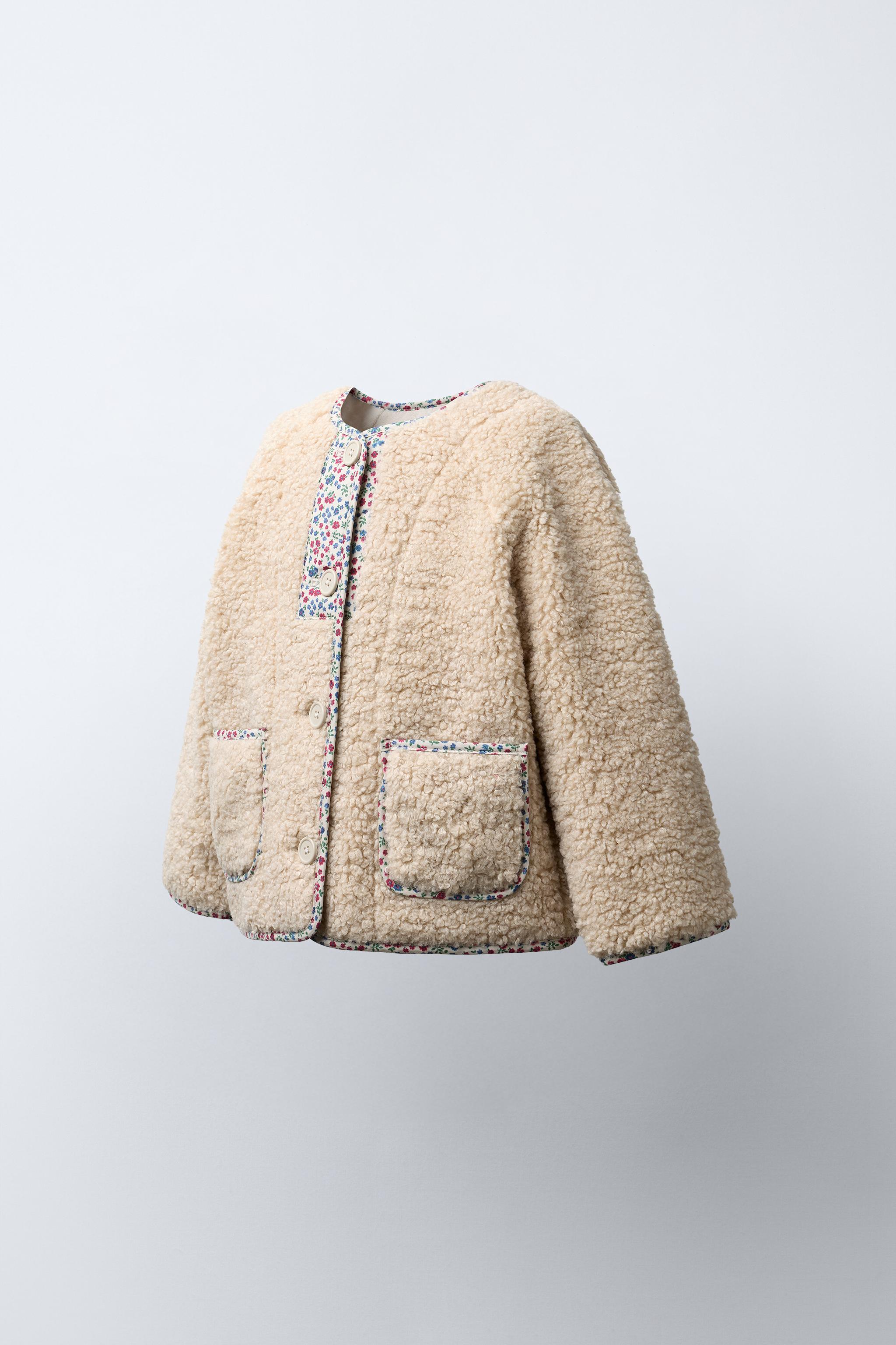 VESTE EFFET MOUTON À LISERÉS FLEURIS